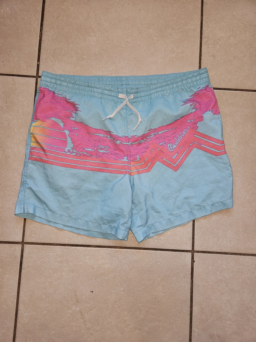 chubbies Light Blue Swim Trunks with Pink and Yellow Graphic